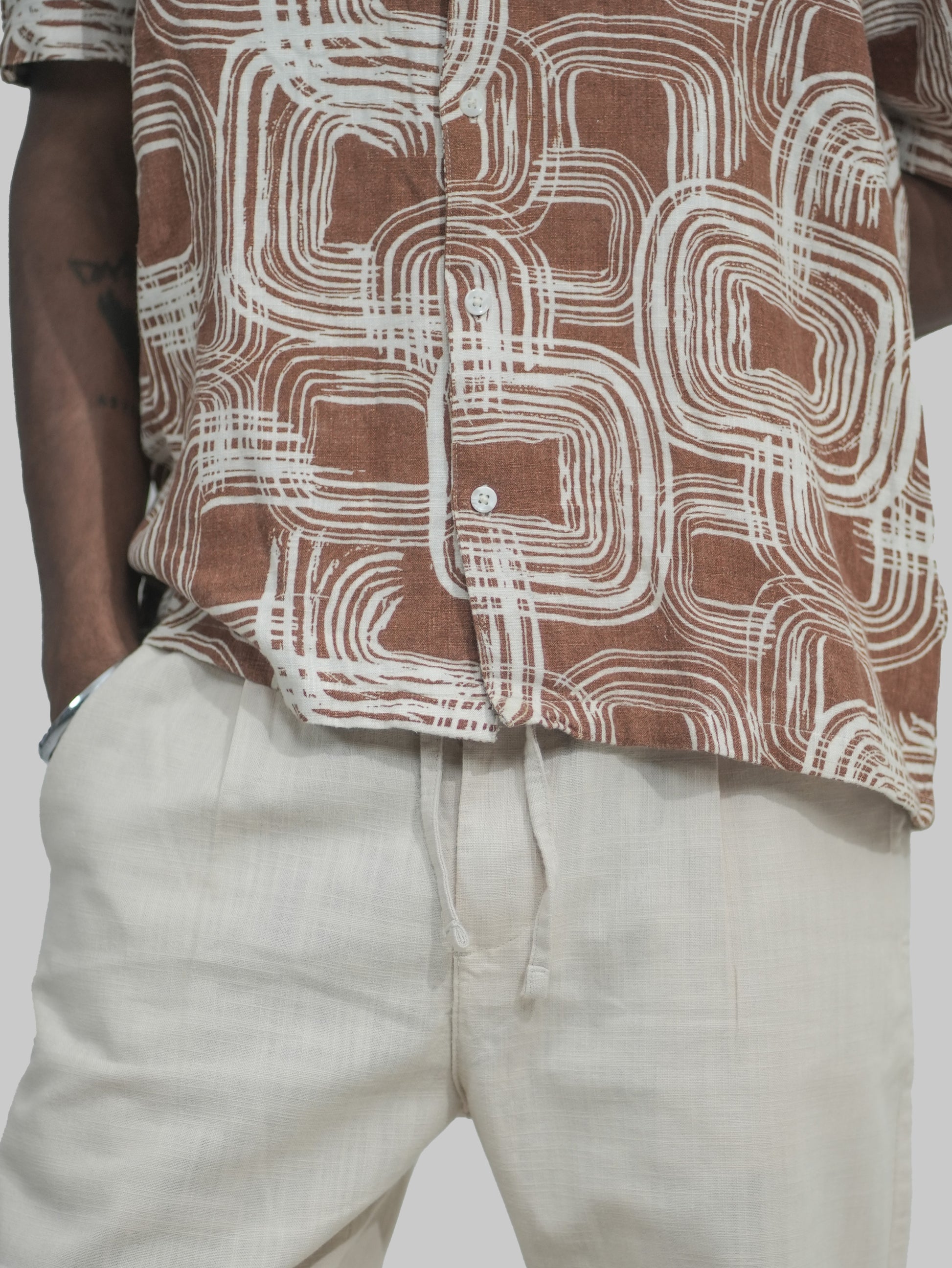 Beige linen trousers fabric close-up breathable lightweight texture