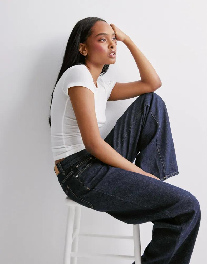 Women Dark Blue Wide Leg Jeans Sitting Side VIew